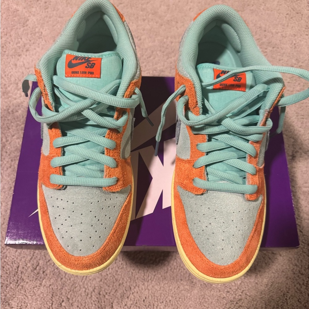 Nike Sneakers in Orange and Blue with Bold Swoosh and Textured Upper